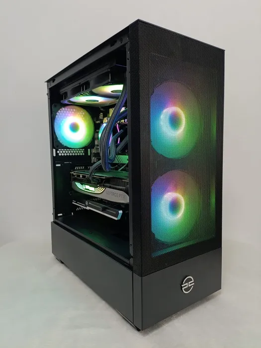 Black gaming computer with an illuminated front fan and visible cooling tubes