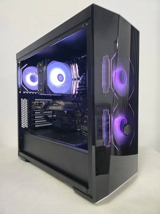 Black glass-sided gaming PC with purple-lit cooling fans