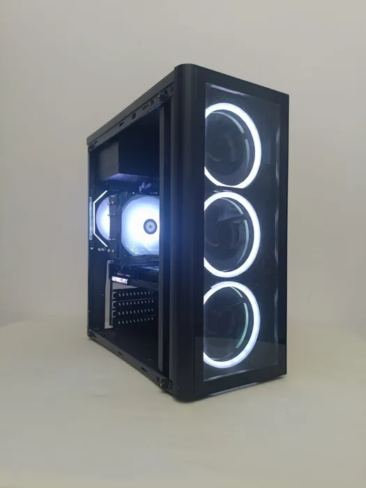 Black desktop tower with three white illuminated front fan rings