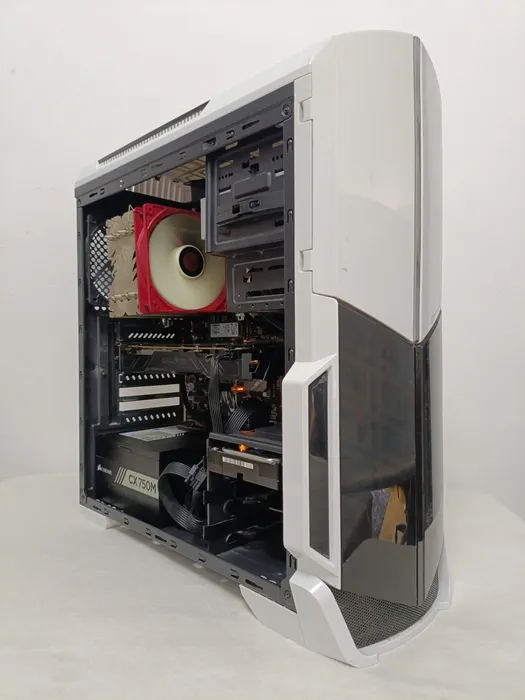 White tower with an open side showing the processor cooler and drive bays